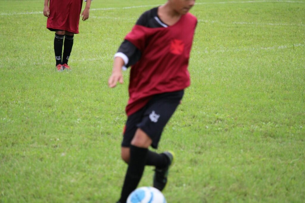 a group of young men playing a game of soccer