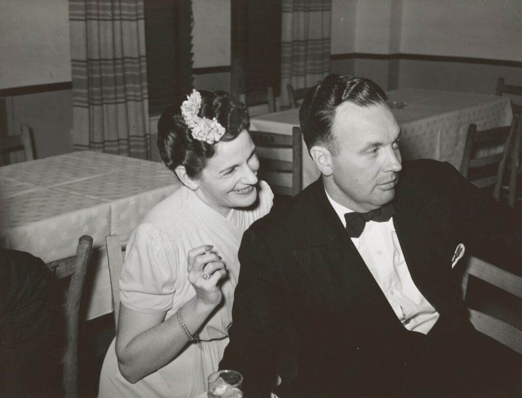 Couple sitting out a dance during the San Angelo Fat Stock Show, San Angelo, Texas. The stock show is an important social occasion in west Texas. 1940