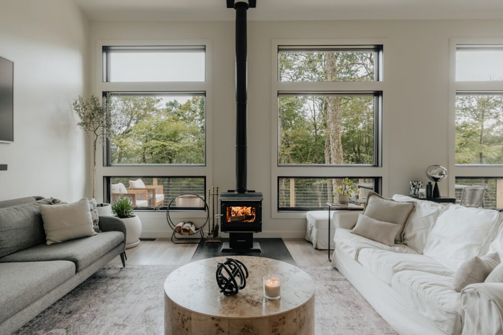 Modern living room with wood stove (IG: @clay.banks)